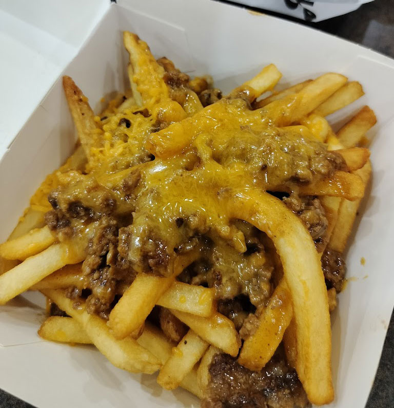 Carl's Jr. offers S2.99 Beef Chilli Cheese Fries with this Online Deal
